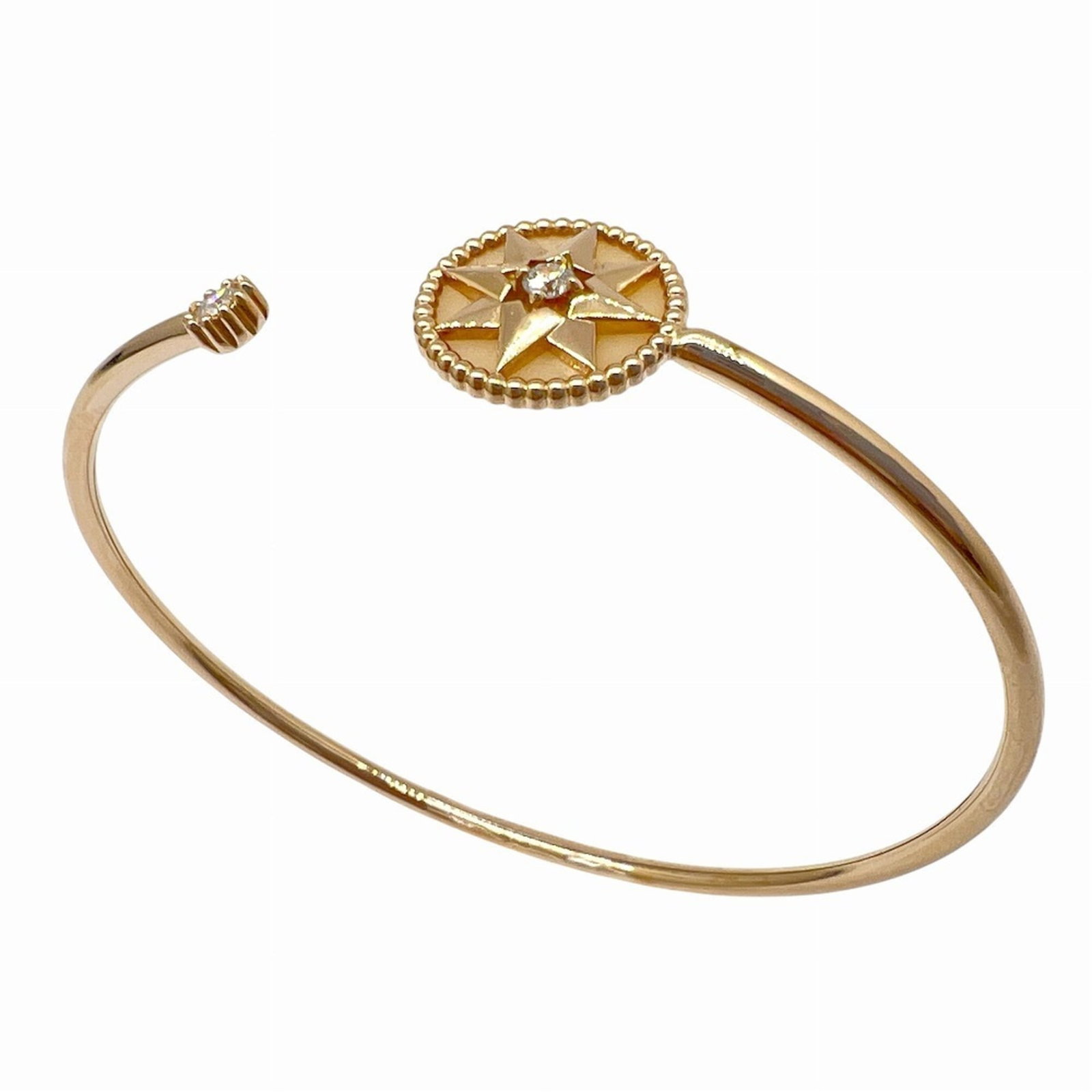 Christian Dior Mother Bangle Pearl: Christian Dior Mother Bangle Pearl Pink gold Mother of pearl bangle with diamond stone, measuring 15cm in length. This elegant Christian Dior design showcases the beauty of mother of pearl and diamond