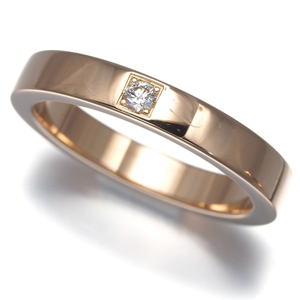 Diamond Ring 1P US4.5 18K 750 Rose Gold Marry: Diamond Ring 1P US4.5 18K 750 Rose Gold Marry 18k rose gold band adorned with a natural diamond, bearing the signature of its creator. The ring's elegant design and luxurious metal make it a beautiful