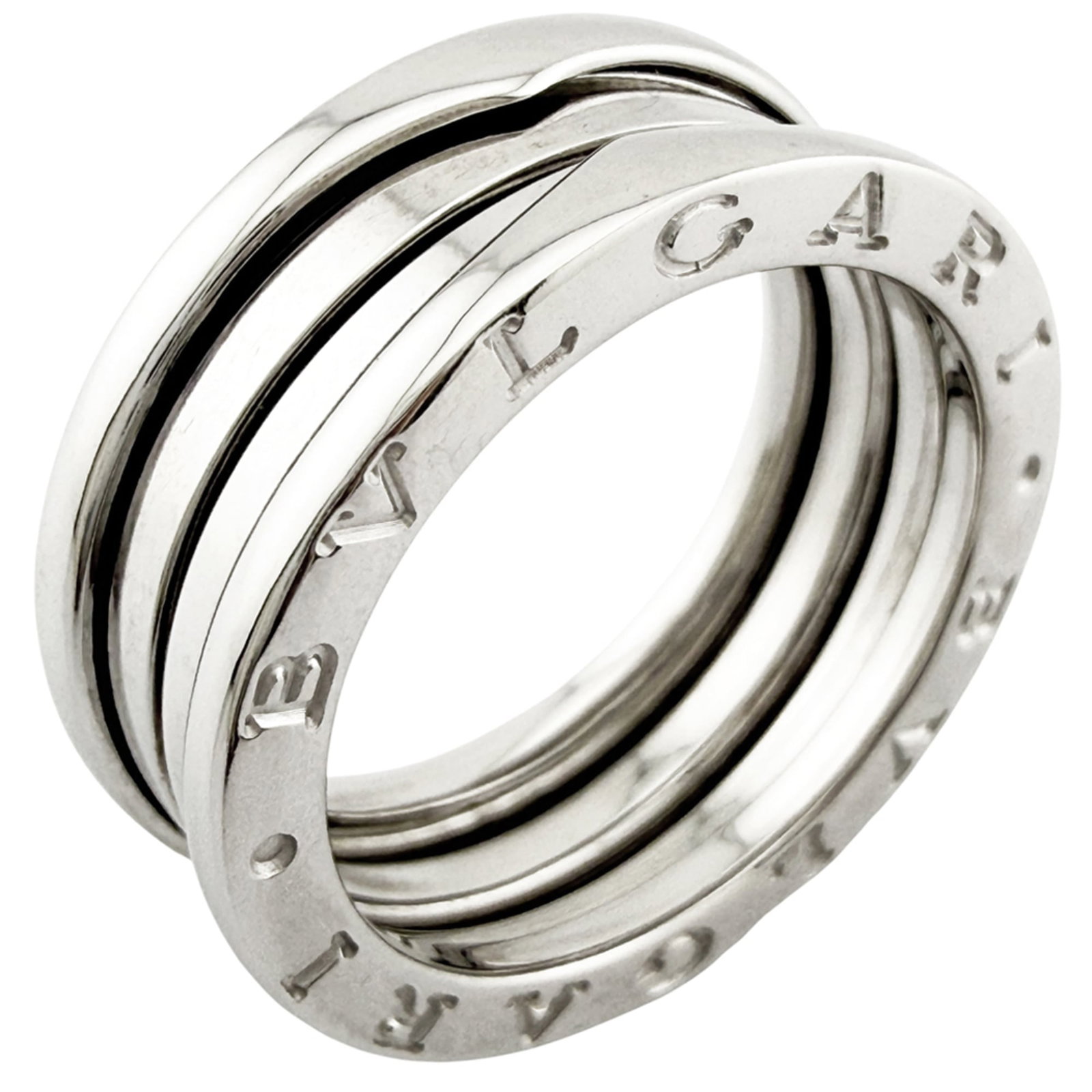 White Gold Bvlgari Ring Band: White Gold Bvlgari Ring Band White gold Bvlgari ring band, crafted from 18K white gold, features the iconic brand's signature style. This elegant band is available in a US size 8, making it a versatil