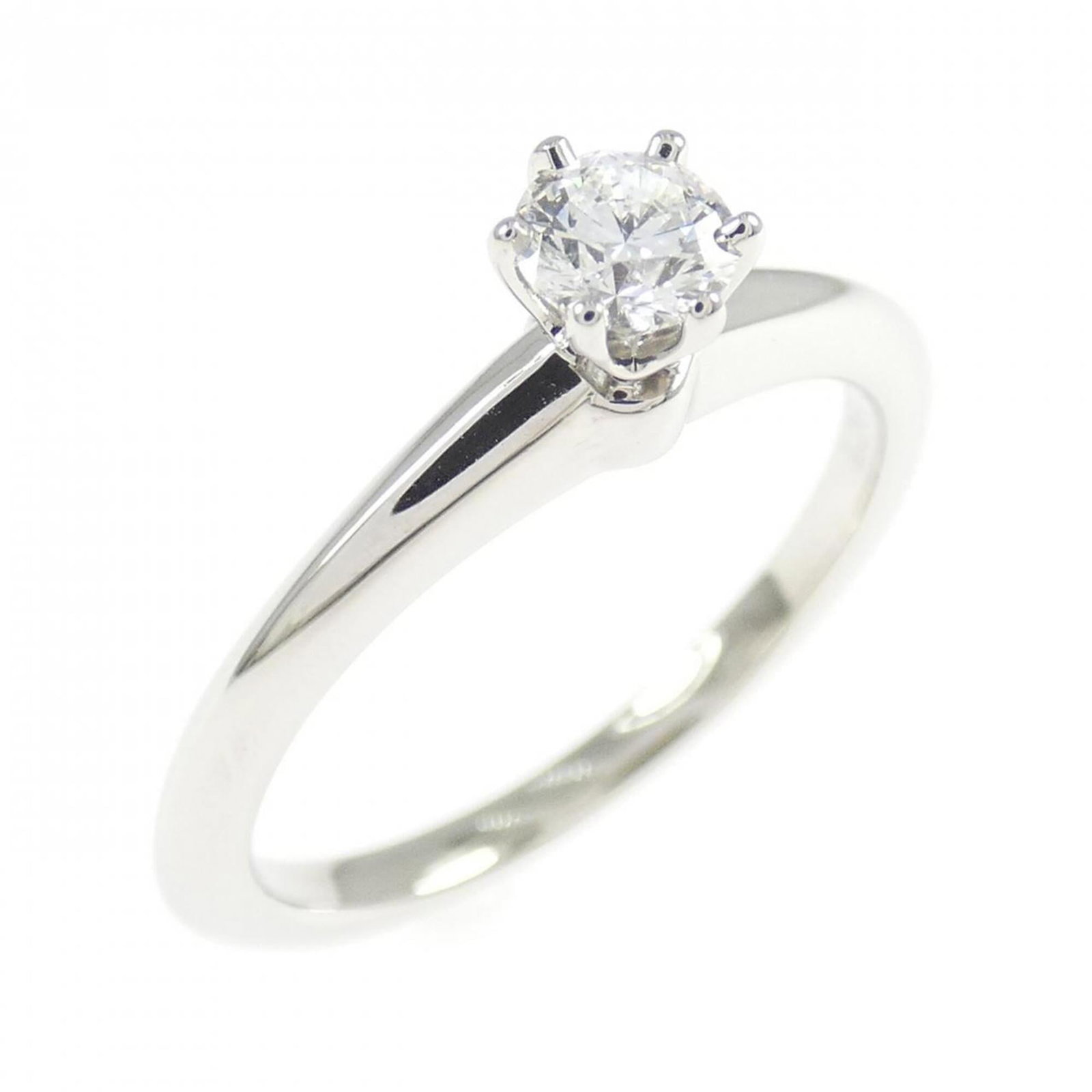 Tiffany Classic Solitaire Ring 0.23Ct: Tiffany Classic Solitaire Ring 0.23Ct Tiffany's iconic Classic Solitaire Ring showcases a stunning 0.23 carat platinum stone set in sterling silver, making for a timeless and elegant accessory. This U