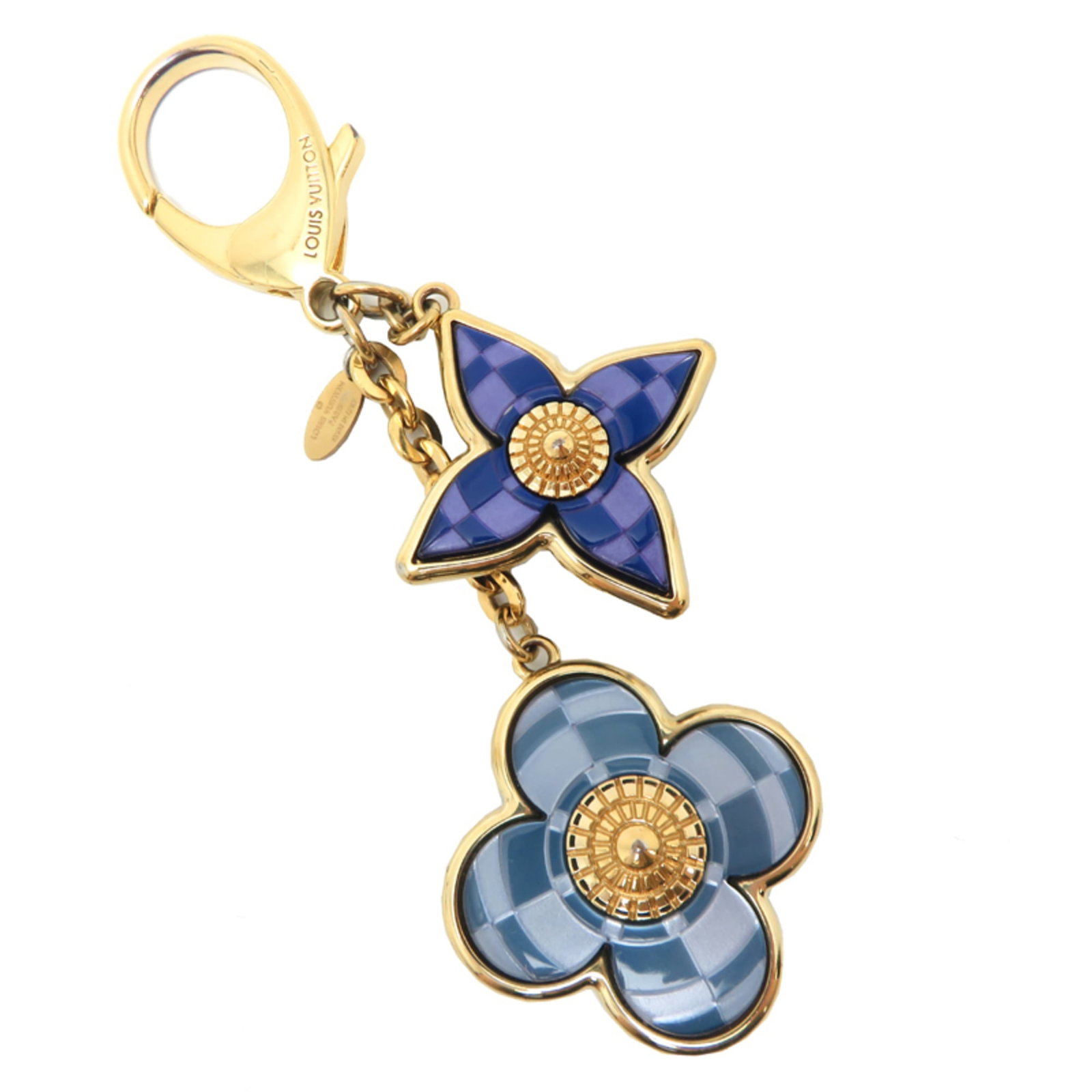 Handbag charm gold plating by Louis Vuitton: Handbag charm gold plating by Louis Vuitton Gold plating from Louis Vuitton adds a touch of luxury to any outfit with its sleek design and vibrant blue hue. This handbag charm boasts a precise size, m