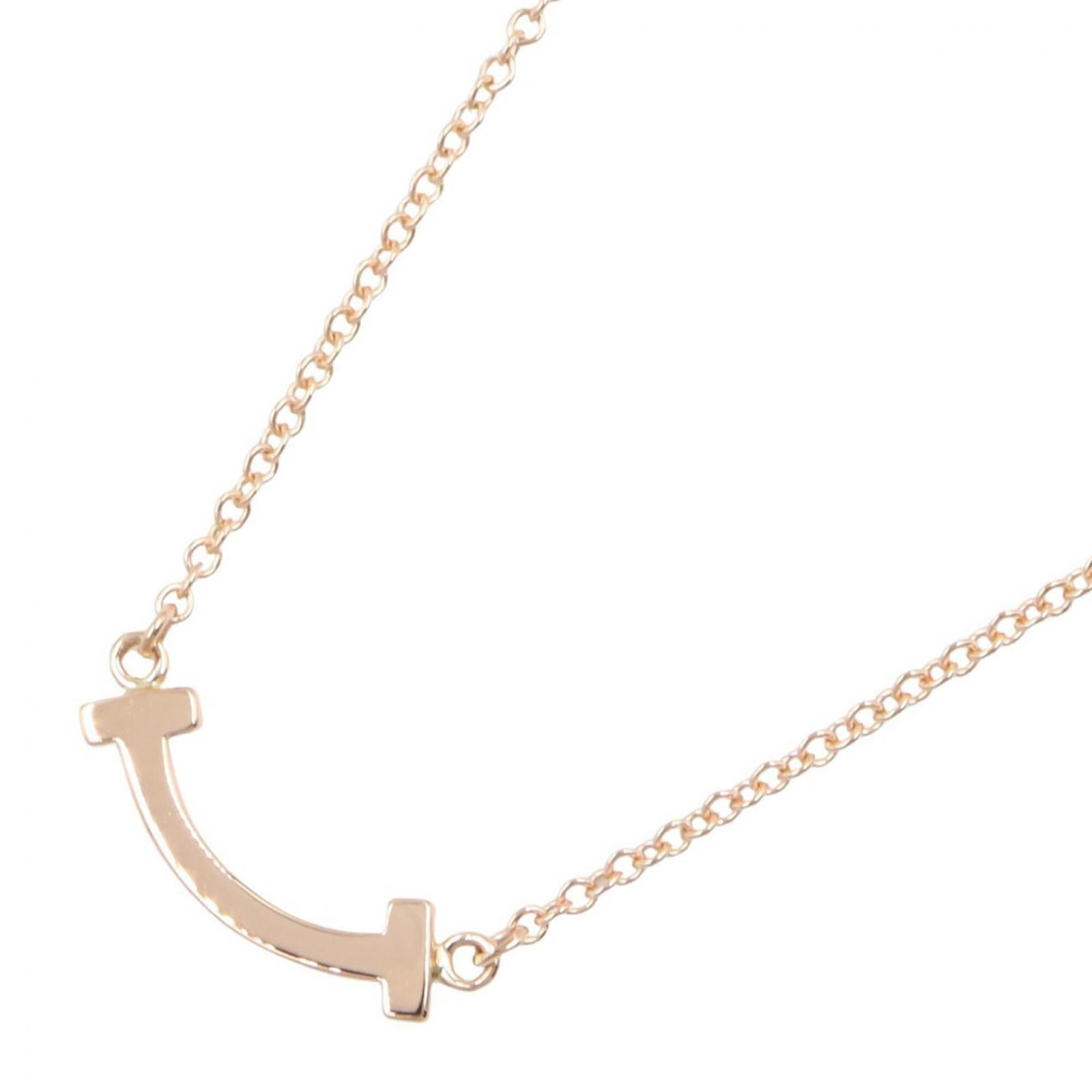 Tiffany & Co. T Smile Mini Necklace 18K Pink Gold (Pg) Women'S Jewelry Tone: Tiffany & Co. T Smile Mini Necklace 18K Pink Gold (Pg) Women'S Jewelry Tone 18K pink gold Tiffany & Co. T Smile Mini Necklace boasts a delicate design with a 3mm x 13mm pendant, set against a chain