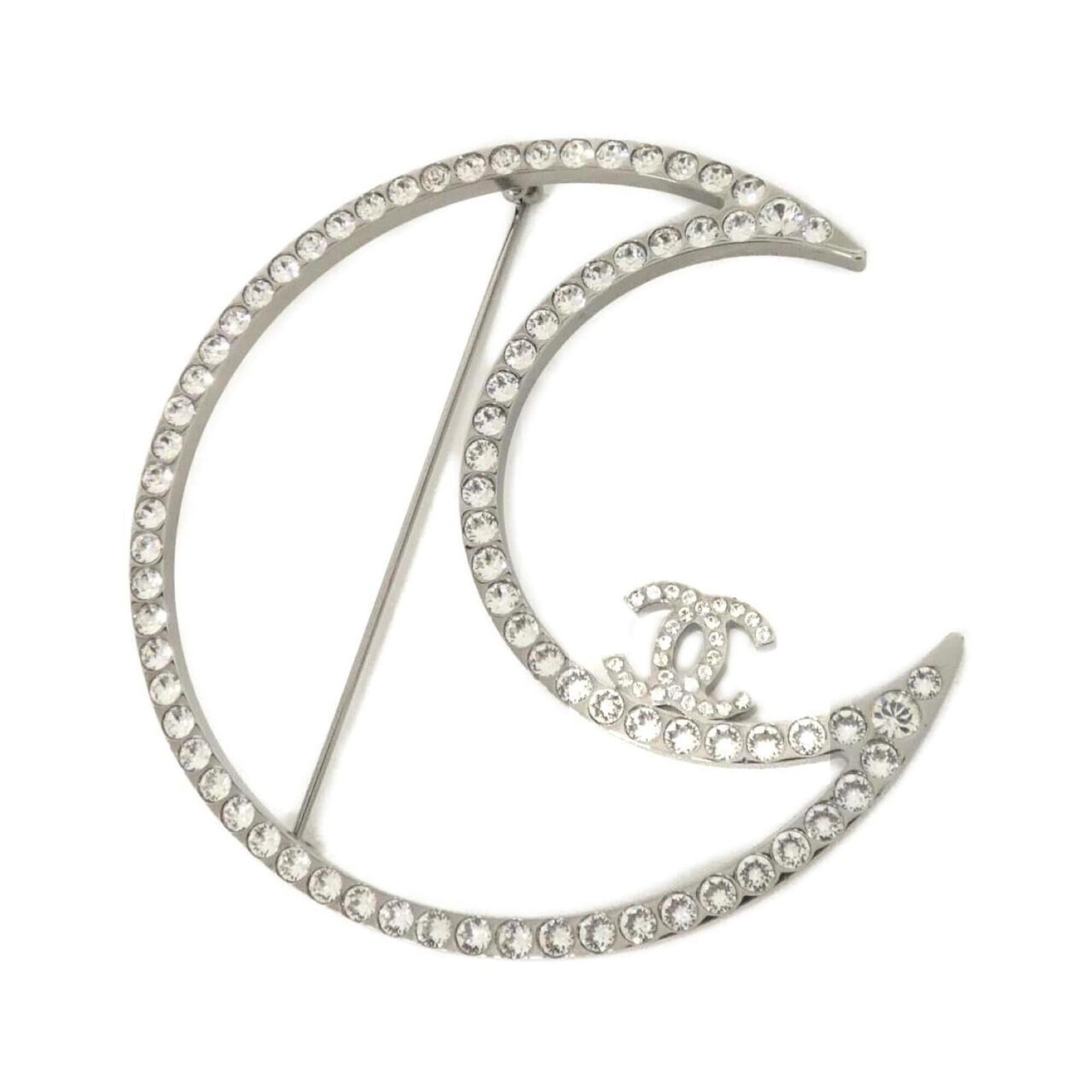 Chanel Brooch: Chanel Brooch The Chanel brooch boasts a sleek silver design, featuring crystal accents that add a touch of luxury. Measuring 8cm x 8cm in size, it presents a striking visual presence with its crisp l