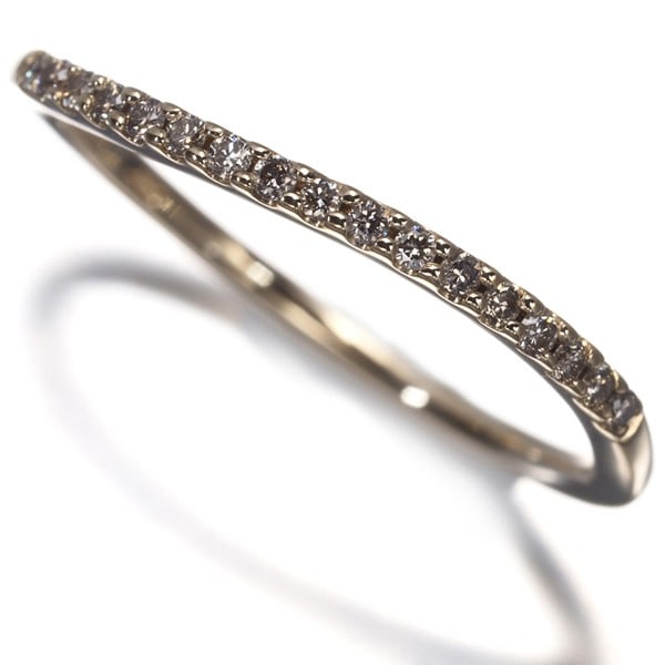 Ring Diamond Wave Half Eternity Us4-4.25 10K 416 Yellow Gold: Ring Diamond Wave Half Eternity Us4-4.25 10K 416 Yellow Gold Yellow gold ring featuring a natural diamond set in a half eternity design, with a 10k purity and 416 hallmark. The ring boasts a delicate 