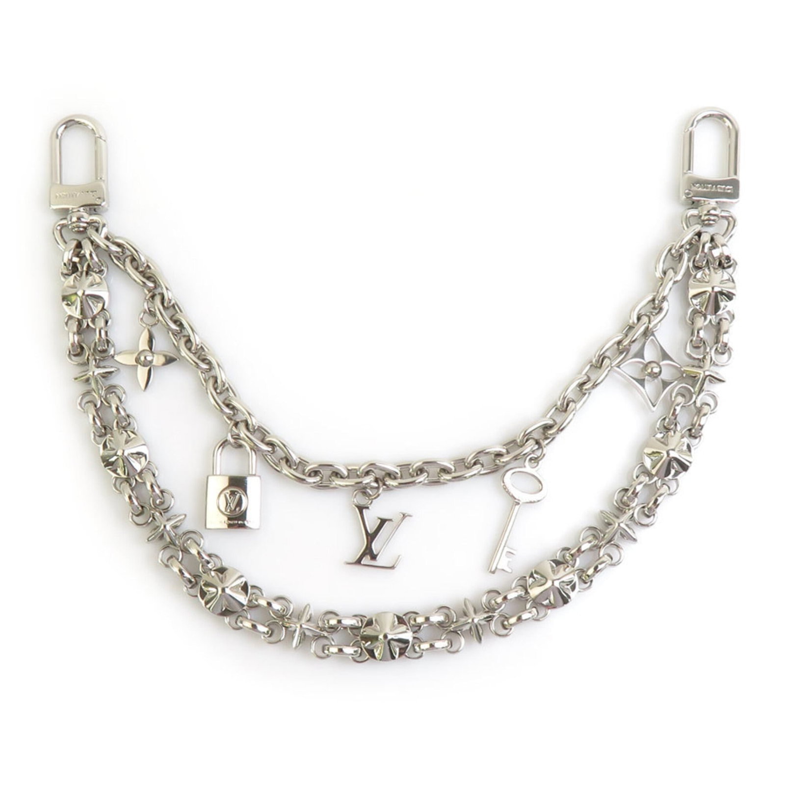 Metal Handbag Louis Vuitton Charm: Metal Handbag Louis Vuitton Charm Silver Metal Handbag Louis Vuitton Charm, bearing the MPN M00999 and crafted from metal, adds a touch of luxury to any accessory. Made in Italy, this charm showcases 