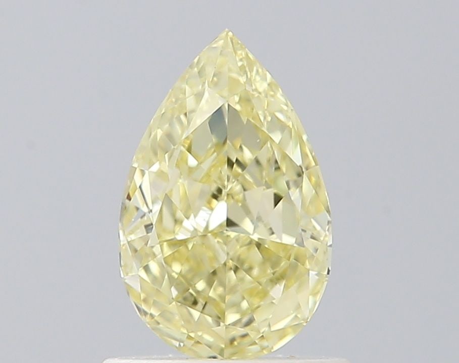 GIA Pear 0.71ct Fancy Yellow IF - Loose Natural Diamond: GIA Pear 0.71ct Fancy Yellow IF - Loose Natural Diamond GIA-certified Fancy Yellow IF diamond, weighing 0.71 carats, boasts exceptional clarity and polish with an EX rating. This loose natural stone f