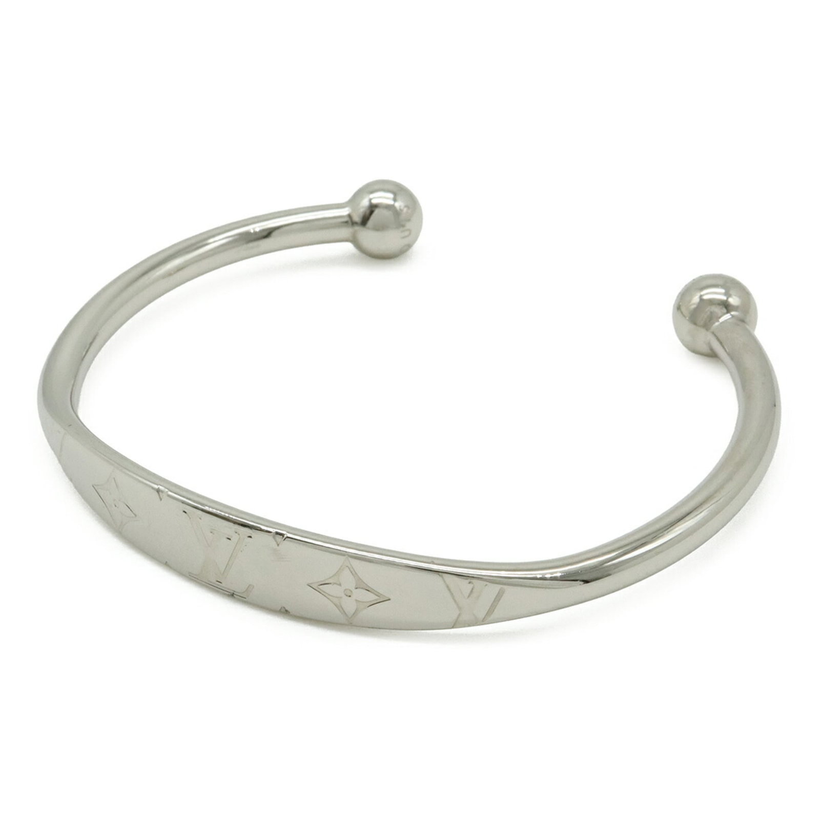 Metal bangle Louis Vuitton: Metal bangle Louis Vuitton Silver metal bangle from Louis Vuitton's Monogram line, measuring 17.5cm in length. This bangle features the iconic Monogram pattern, a hallmark of the brand's signature sty
