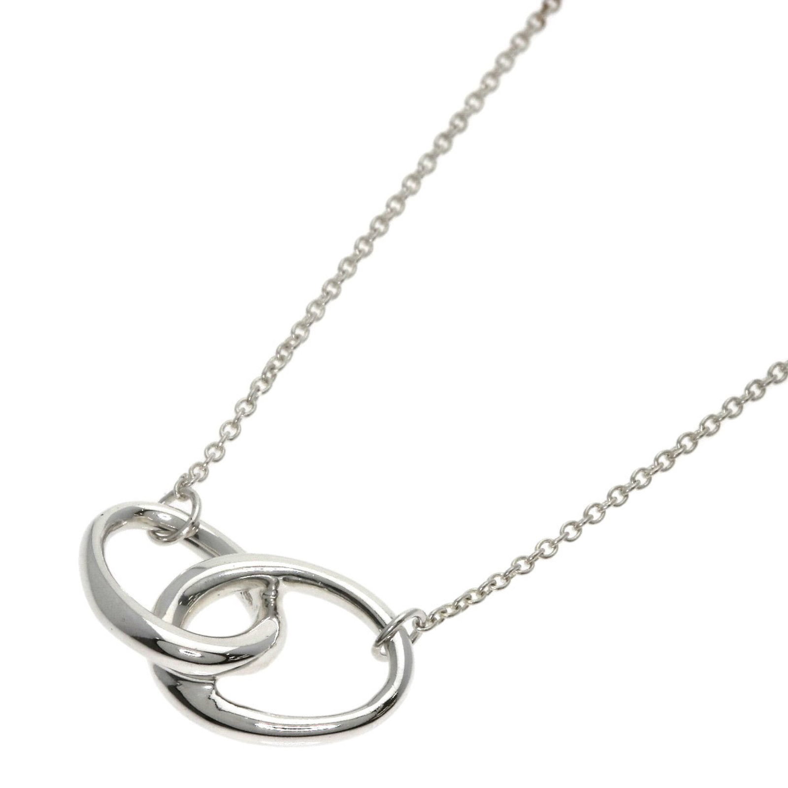 Women's silver necklace loop double Tiffany.: Women's silver necklace loop double Tiffany. Silver necklace loop double Tiffany features a pendant with dimensions 10.6mm x 19mm, set in a 41 cm / 16.14'' chain. The item bears a signature and is mad