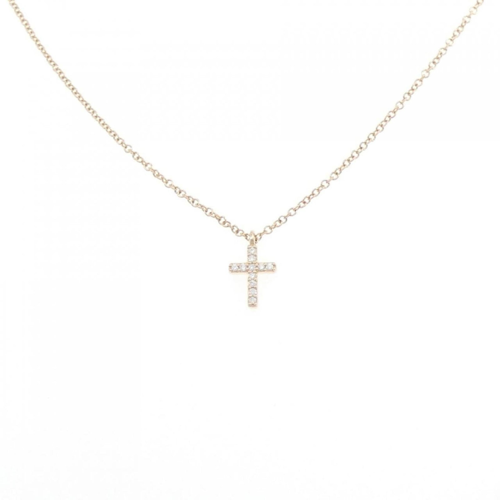 Metro Cross Tiffany Necklace: Metro Cross Tiffany Necklace Pink gold (18K) pendant featuring a diamond, suspended from a chain with a circumference of 41 cm. The pendant measures 9.8mm x 5.9mm and is set in pink gold. A Tiffany