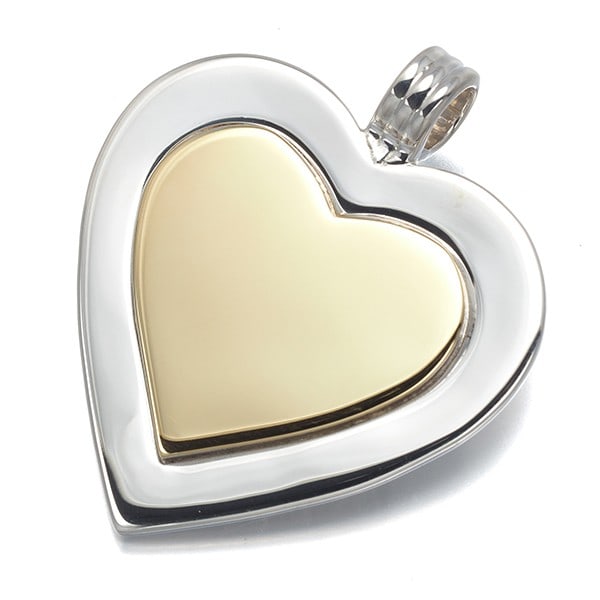 Pendant heart bicolor 925 sterling silver by Tiffany & Co: Pendant heart bicolor 925 sterling silver by Tiffany & Co Sterling silver pendant by Tiffany & Co, featuring a striking bicolor design. This beautiful piece boasts a 18k gold plating that adds a touch
