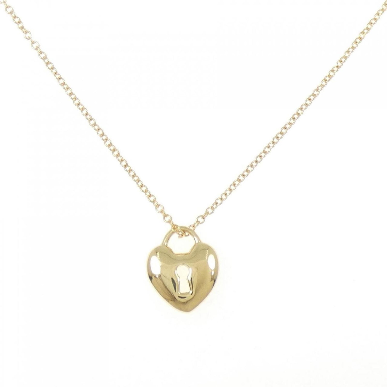 Heart lock mini necklace by Tiffany: Heart lock mini necklace by Tiffany Yellow gold (18K) pendant necklace from Tiffany, featuring a heart lock design. The necklace measures 40 cm in circumference and the pendant itself is 11.1mm x 9.4m