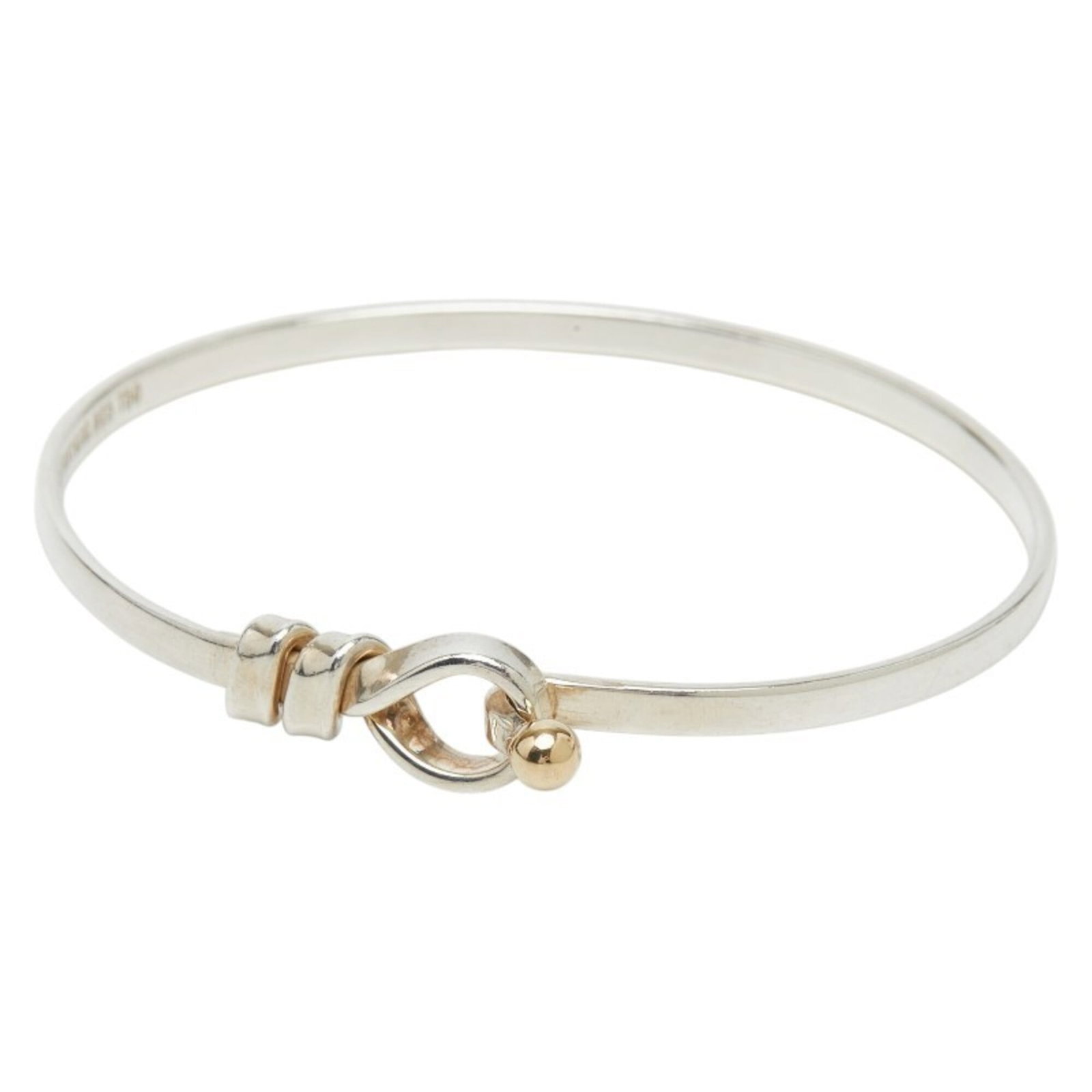 Yellow Gold 925 Bangle Silver Tiffany: Yellow Gold 925 Bangle Silver Tiffany Yellow gold accents add a touch of elegance to this sterling silver bangle, featuring intricate details that catch the light. Made from high-quality materials, in