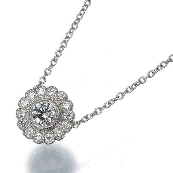 Platinum Milgrain Flower Diamond Necklace Tiffany&Co: Platinum Milgrain Flower Diamond Necklace Tiffany&Co Platinum Milgrain Flower Diamond Necklace by Tiffany & Co. features a natural diamond pendant set in platinum, with intricate milgrain details that