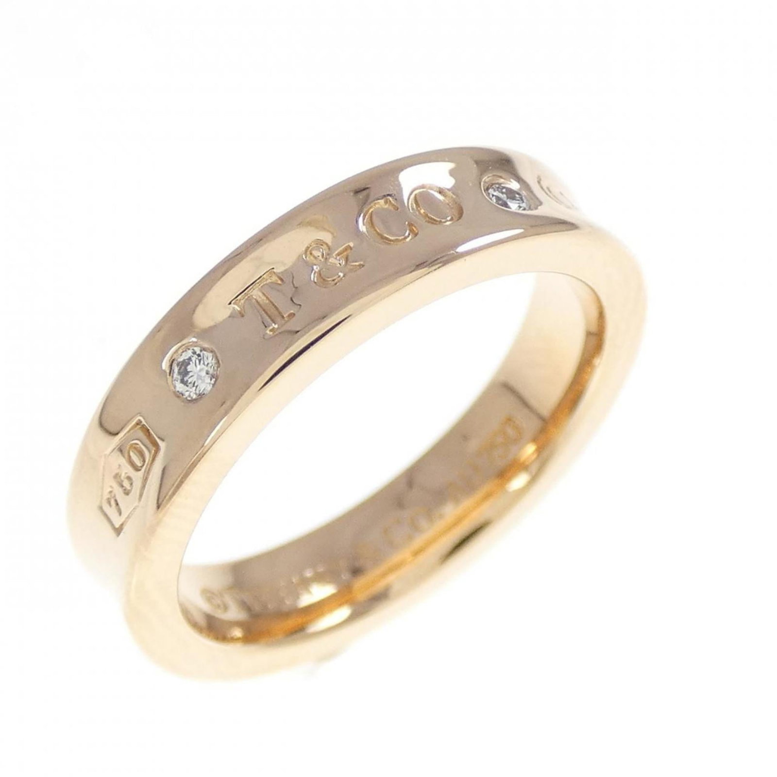 Pink Gold Tiffany Ring Band: Pink Gold Tiffany Ring Band Pink gold Tiffany ring band, featuring an 18K pink gold band with a diamond stone. This US size 4.5 band showcases the brand's signature style and craftsmanship. Made from 