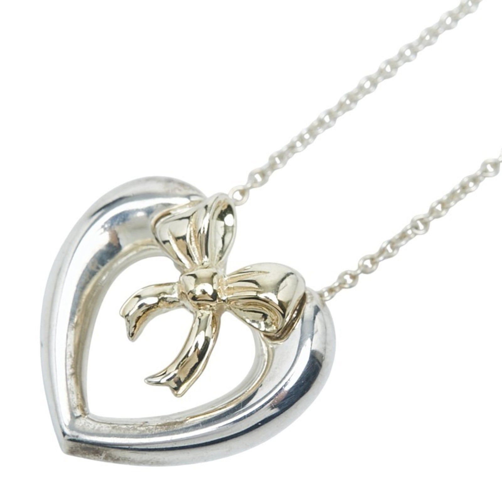 Tiffany Heart And Ribbon Combination Necklace In Sv925 Silver 18K Yellow Gold. Women'S. Tiffany &: Tiffany Heart And Ribbon Combination Necklace In Sv925 Silver 18K Yellow Gold. Women'S. Tiffany & Tiffany & Co. necklace in sterling silver and 18K yellow gold, featuring a heart-shaped pendant adorne