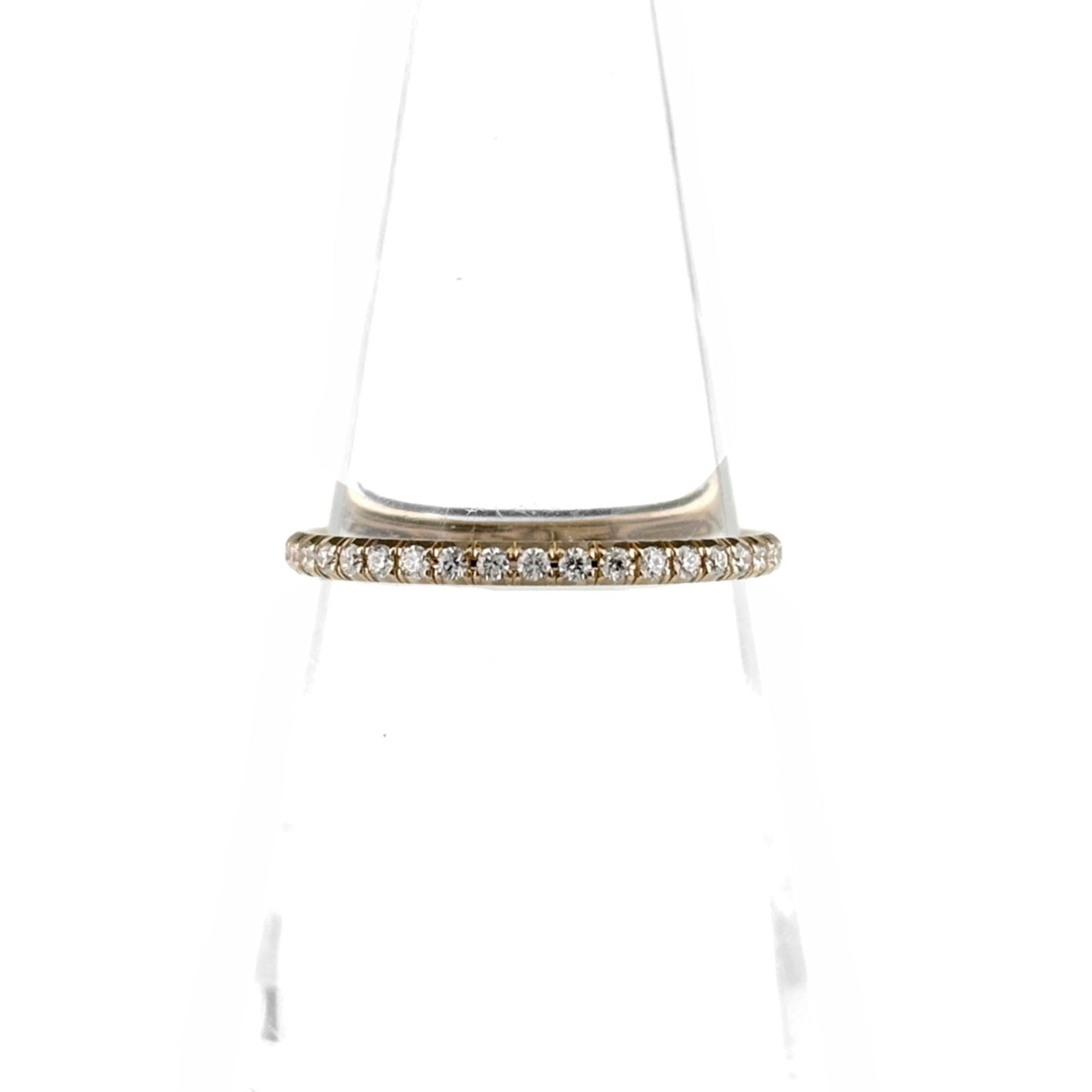 Ring Tiffany Band: Ring Tiffany Band The Tiffany Type band ring boasts an elegant pink hue and 18K gold metal, making it a striking accessory for any occasion. A delicate diamond weighs 0.19 carats, adding a touch of so
