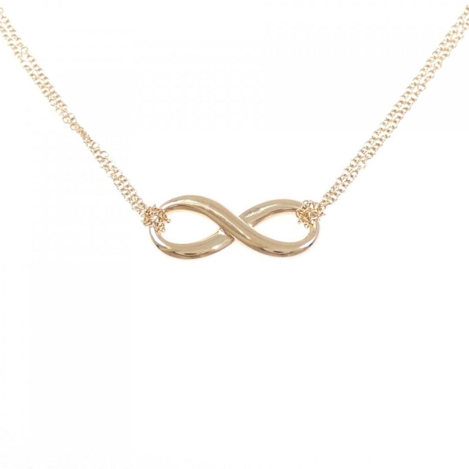 Infinity of Tiffany: Infinity of Tiffany Pink gold (18K) pendant necklace with a 8.2mm x 20mm pendant, set in an Infinity design on a 41 cm / 16.14'' chain. The necklace features a striking pink gold hue and a unique infi