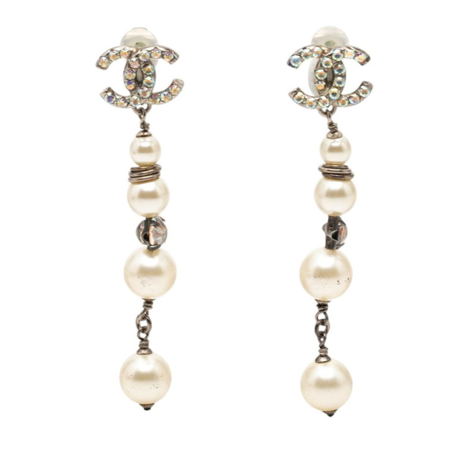 Metal clip earrings by Chanel: Metal clip earrings by Chanel Silver metal clip earrings by Chanel, featuring artificial pearl and rhinestone details, measuring 73.60mm x 15.80mm in size. This stylish accessory showcases a sleek