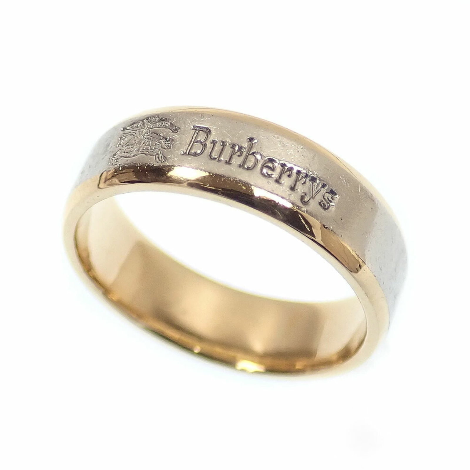 Burberry Band Ring Platinum 1000 Yellow Gold (18K): Burberry Band Ring Platinum 1000 Yellow Gold (18K) Platinum 1000, yellow gold (18K) construction provides exceptional durability and shine. This Burberry Band Ring features a striking platinum band wi
