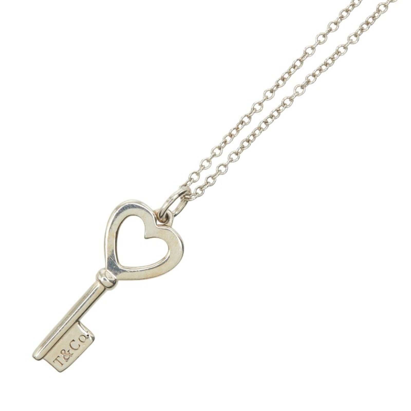 Tiffany Co Heart Necklace Silver Women Sv925: Tiffany Co Heart Necklace Silver Women Sv925 Silver Tiffany Co Heart Necklace for Women, 925 Sterling. This elegant silver necklace features a heart-shaped pendant with a diameter of 8.2mm x 19.5mm, s