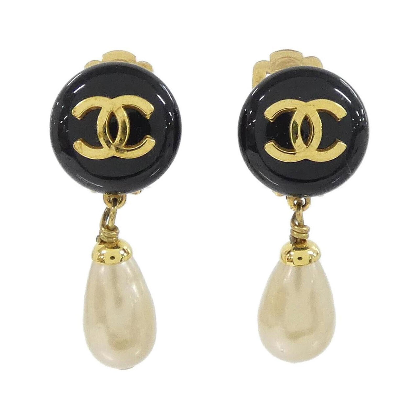 Clip earrings from Chanel: Clip earrings from Chanel Clip earrings from Chanel feature a sleek black and white design, measuring 40.00mm x 15.00mm in size. These chic earring clips are made to be worn close to the ear, adding a