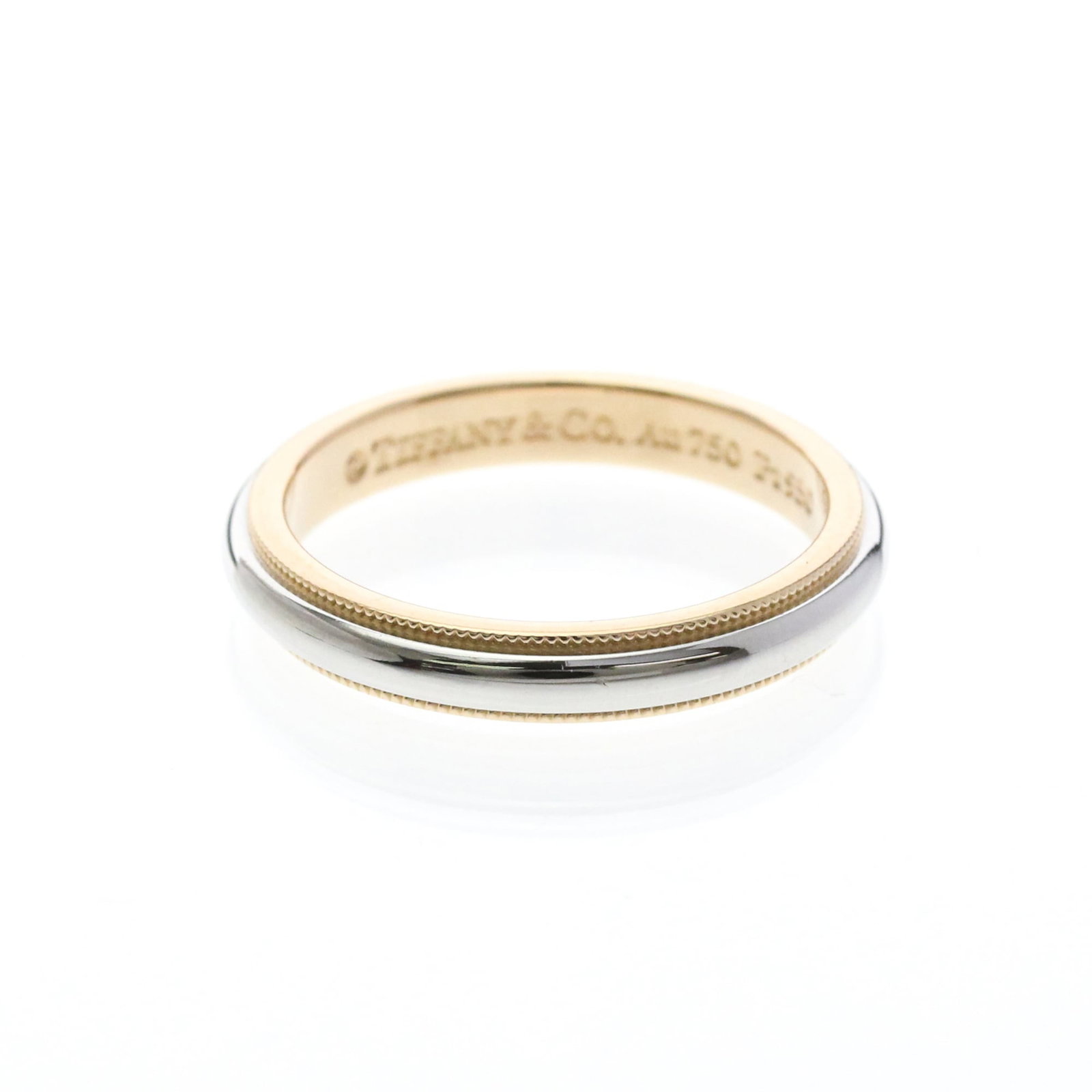 Pink Gold Ring Tiffany Band Platinum: Pink Gold Ring Tiffany Band Platinum Pink gold band ring with intricate milgrain details, crafted from 18K pink gold and platinum metal. This stylish fashion accessory features a sleek design and a su
