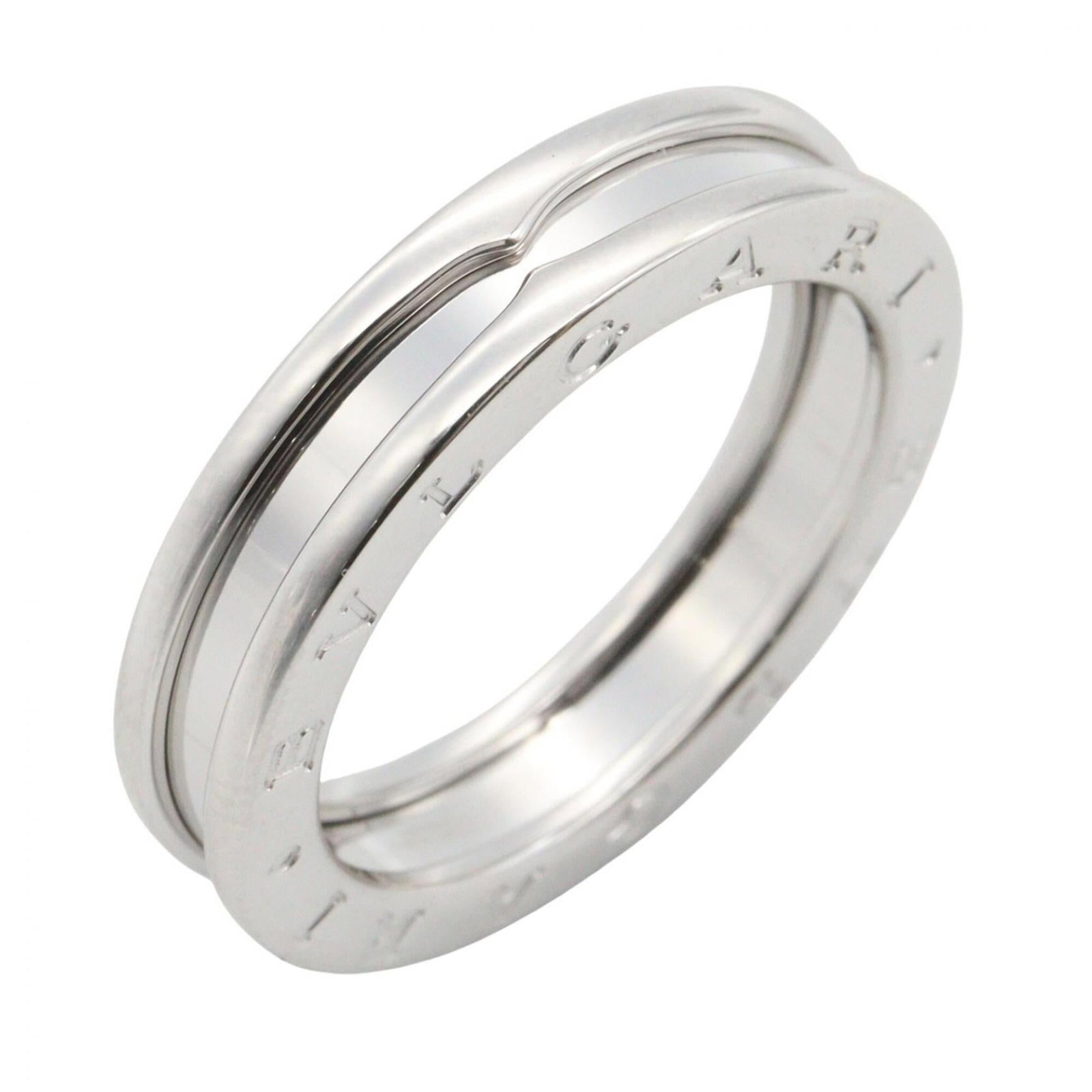 White Gold Bvlgari Ring Band: White Gold Bvlgari Ring Band White gold (18K) band ring from Bvlgari, available in US size 9. This elegant piece features the iconic Bvlgari style with a silver finish. Made from high-quality white
