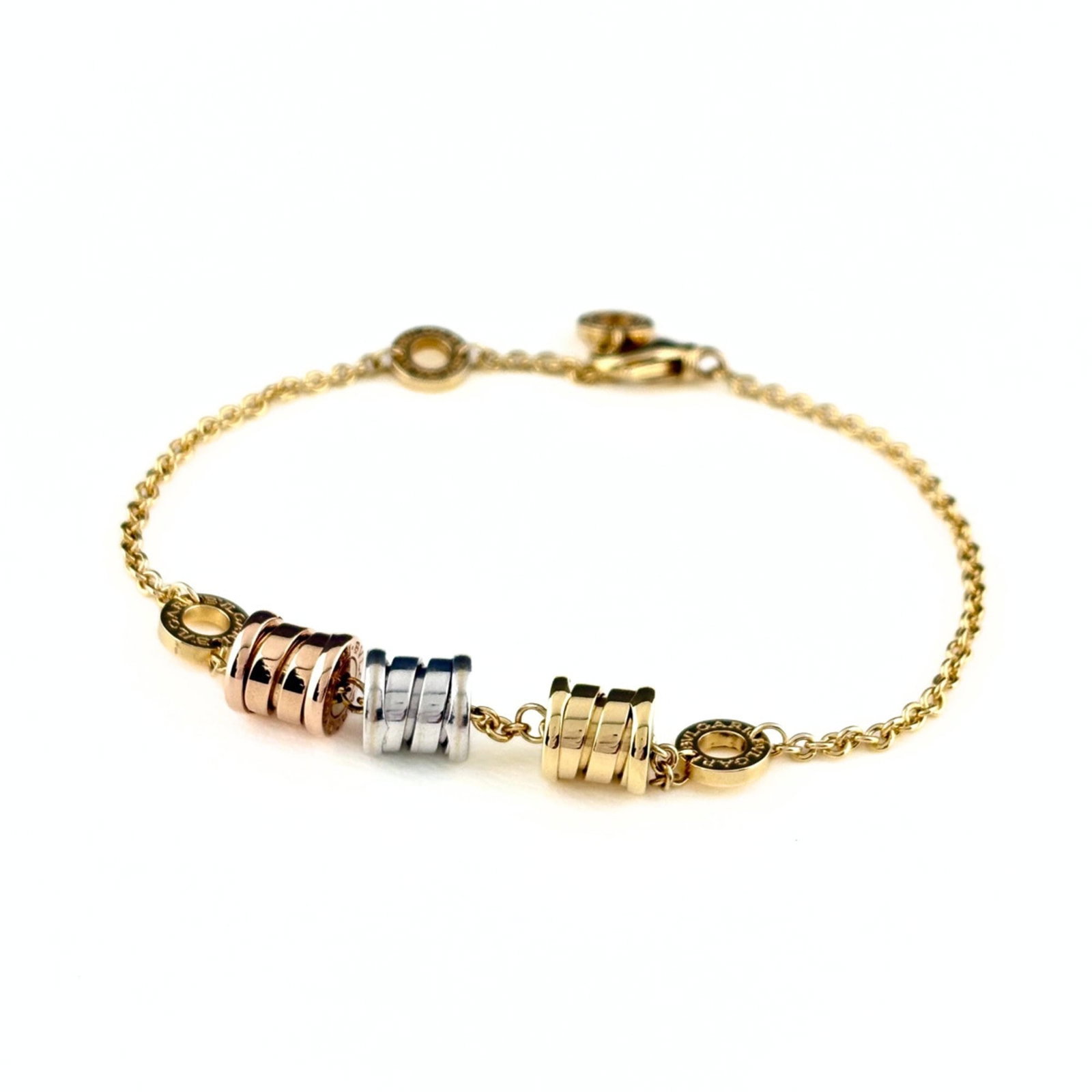 Bvlgari Charm Bracelet: Bvlgari Charm Bracelet Bvlgari Charm Bracelet in 18K Gold, featuring pink, white, and yellow hues. This elegant charm bracelet boasts a length of 17.5cm and weighs 9g, making it a stylish accessory fo