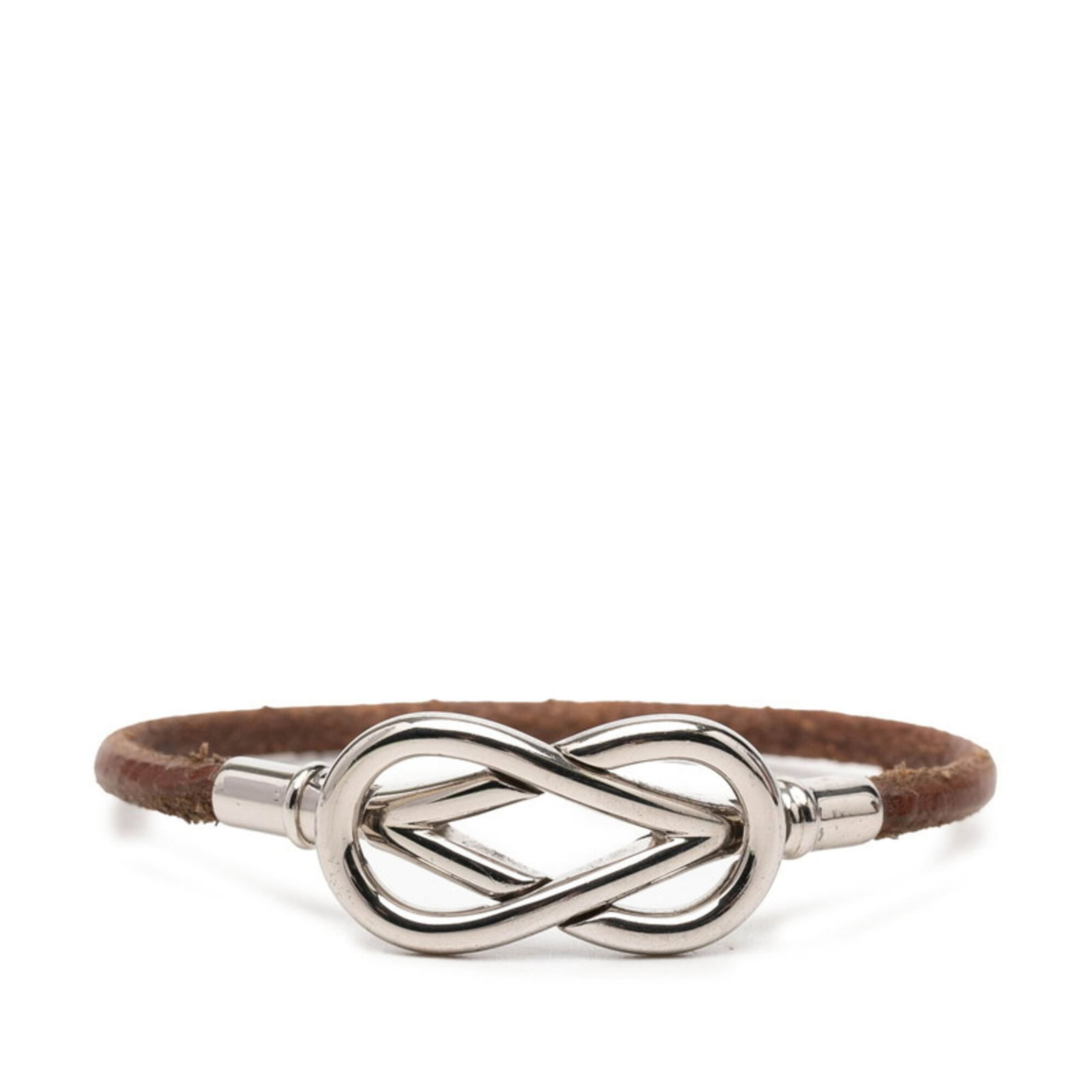 Metal leather bracelet charm Hermes: Metal leather bracelet charm Hermes Brown leather and silver metal combine in a classic charm bracelet from Hermes, measuring 16cm in length. This timeless piece features the iconic brand's signature 