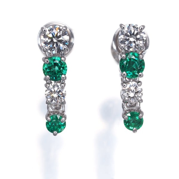 Diamond earrings 0.36Ct emerald drop 750 18K white gold: Diamond earrings 0.36Ct emerald drop 750 18K white gold 0.36ct emerald drop earrings in 18K white gold, featuring a natural emerald stone and complemented by 0.21ct diamonds. The elegant design showca