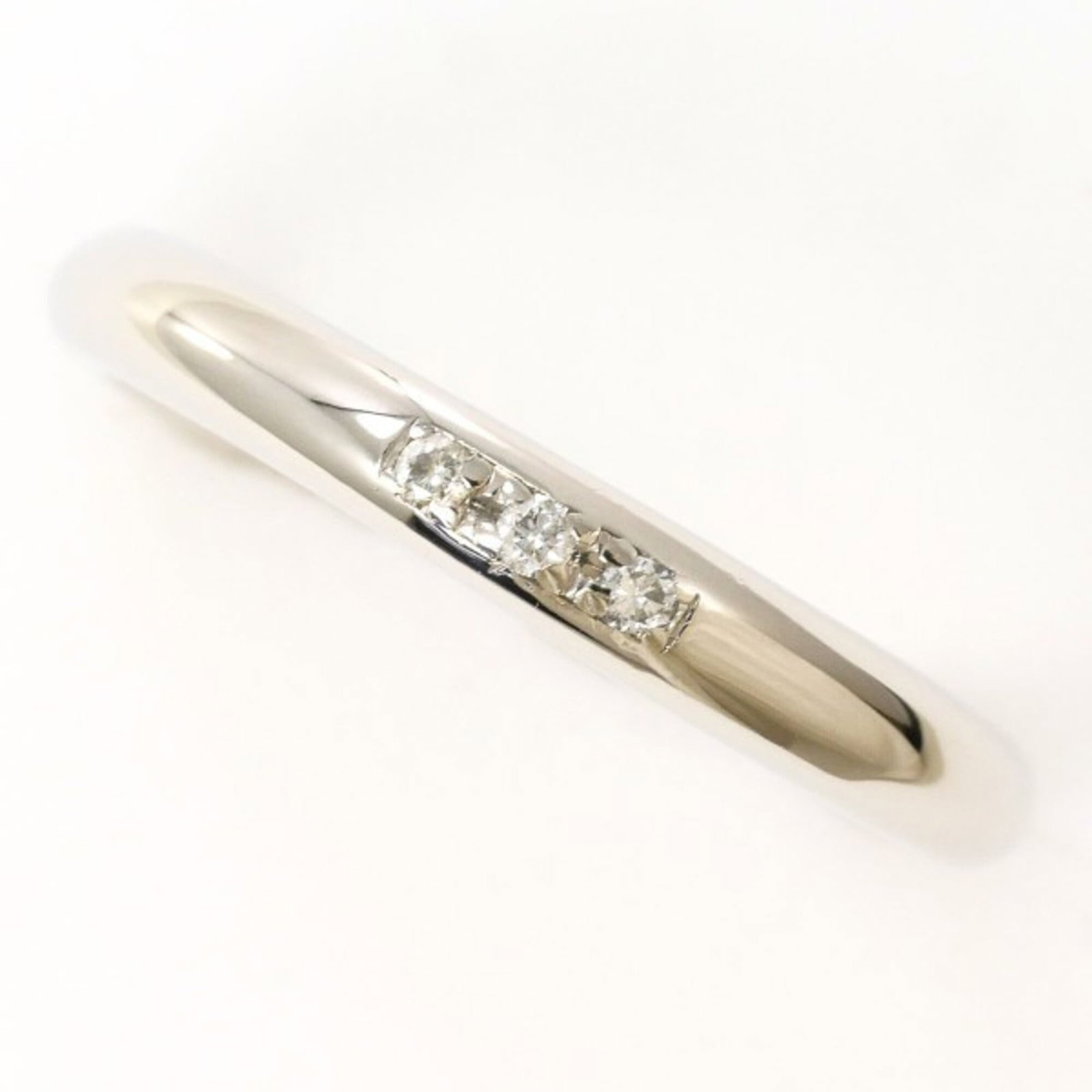 Unbranded Band Ring Platinum 900: Unbranded Band Ring Platinum 900 Platinum 900 band ring features a diamond stone set in an unbranded platinum metal construction, with a US size 3.5 and width of 2mm / 0.08''. The item weighs 3.3g / 0