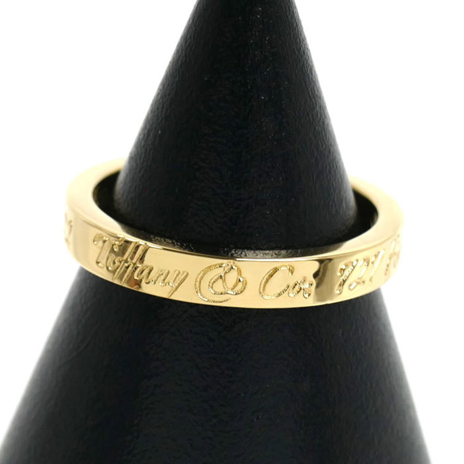 Yellow Gold 18K Tiffany Band Ring: Yellow Gold 18K Tiffany Band Ring Yellow gold (18K) band ring from Tiffany, available in US size 3.5 and featuring the brand's signature style. This 46.5 US size ring showcases a classic design with y