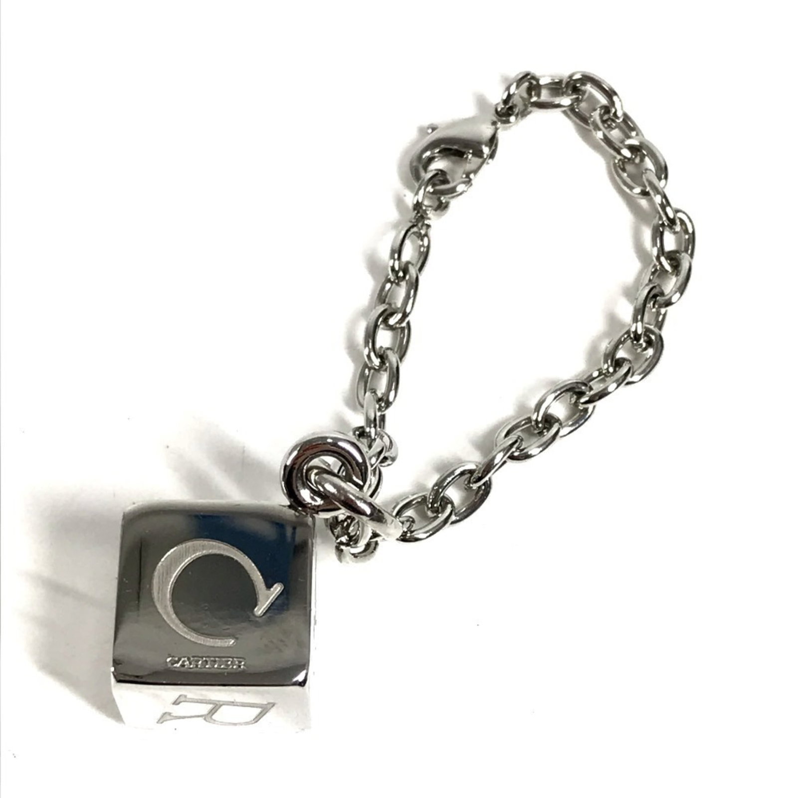 Metal Cartier Charm Handbag: Metal Cartier Charm Handbag Silver Metal Cartier Charm Handbag. This metal handbag charm features the iconic Cartier brand and boasts a sleek, silver finish. A stylish accessory for those who apprecia