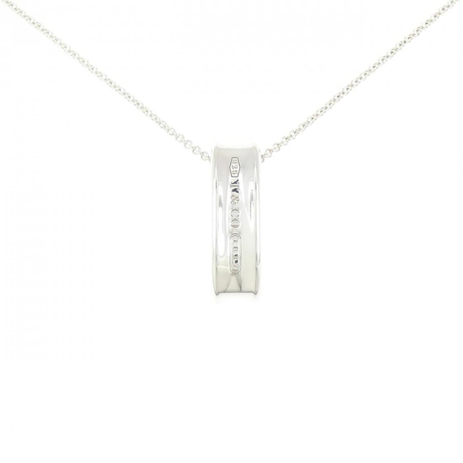 Tiffany & Co. 1837 Loop Necklace: Tiffany & Co. 1837 Loop Necklace Tiffany & Co.'s 1837 Loop Necklace boasts a striking silver pendant, measuring 26.2mm x 8mm, suspended from a 46 cm / 18.11'' chain. This elegant piece features the