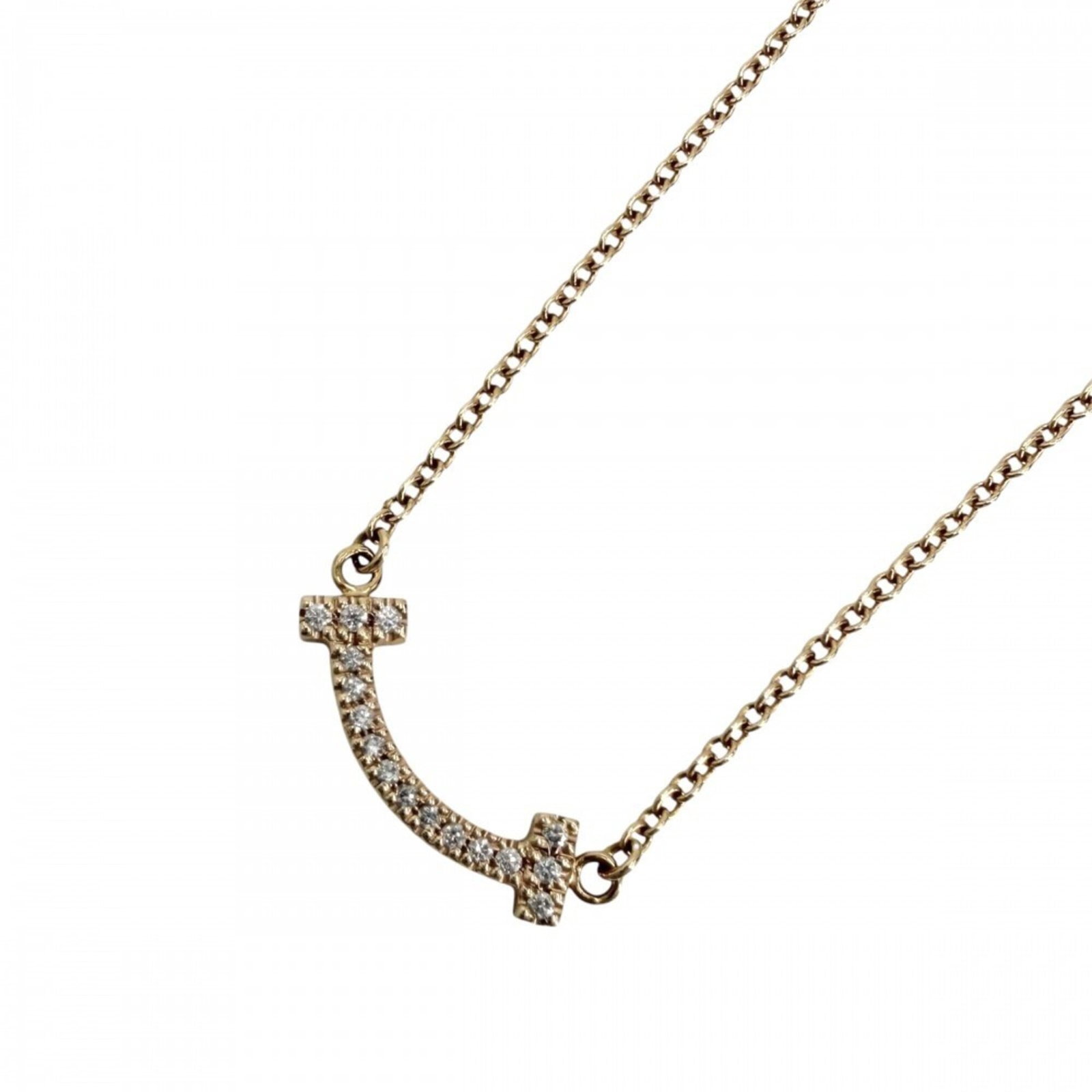 Tiffany & Co. T Smile Mini Pendant Necklace For Women Adjustable 18K Pink Gold (Au750) Diamond: Tiffany & Co. T Smile Mini Pendant Necklace For Women Adjustable 18K Pink Gold (Au750) Diamond Tiffany & Co.'s T Smile Mini Pendant Necklace shines in 18K pink gold, adorned with a delicate diamond. T
