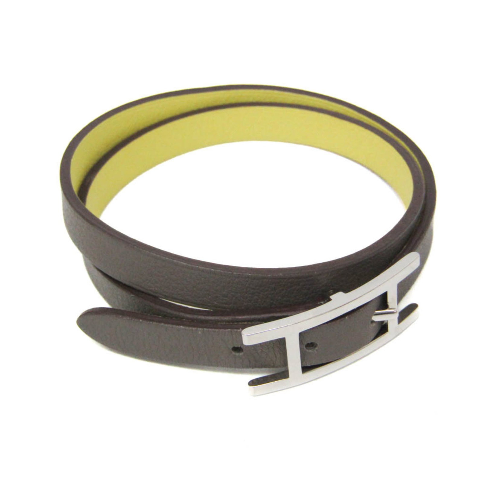 Metal leather wrap bracelet by Hermes: Metal leather wrap bracelet by Hermes Silver metal and gray leather wrap bracelet from iconic French fashion house Hermes, featuring a classic double tour design. Made with high-quality materials, thi