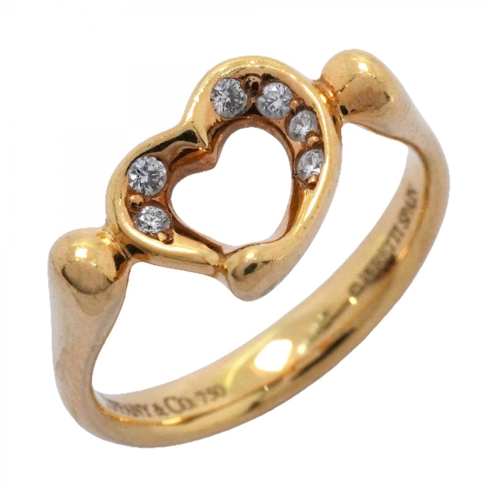 Yellow Gold 18K Tiffany Band Ring: Yellow Gold 18K Tiffany Band Ring Yellow gold 18K Tiffany band ring with a diamond stone, available in US size 5. This elegant piece features the iconic Tiffany brand and high-quality yellow gold mate