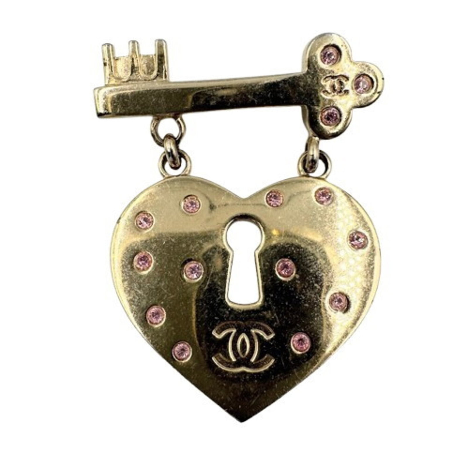 Chanel Brooch: Chanel Brooch Gold plated Chanel brooch featuring a rhinestone pink stone, measuring 5.5cm x 4.3cm in size. This elegant piece boasts a classic design and luxurious finish, making it a beautiful