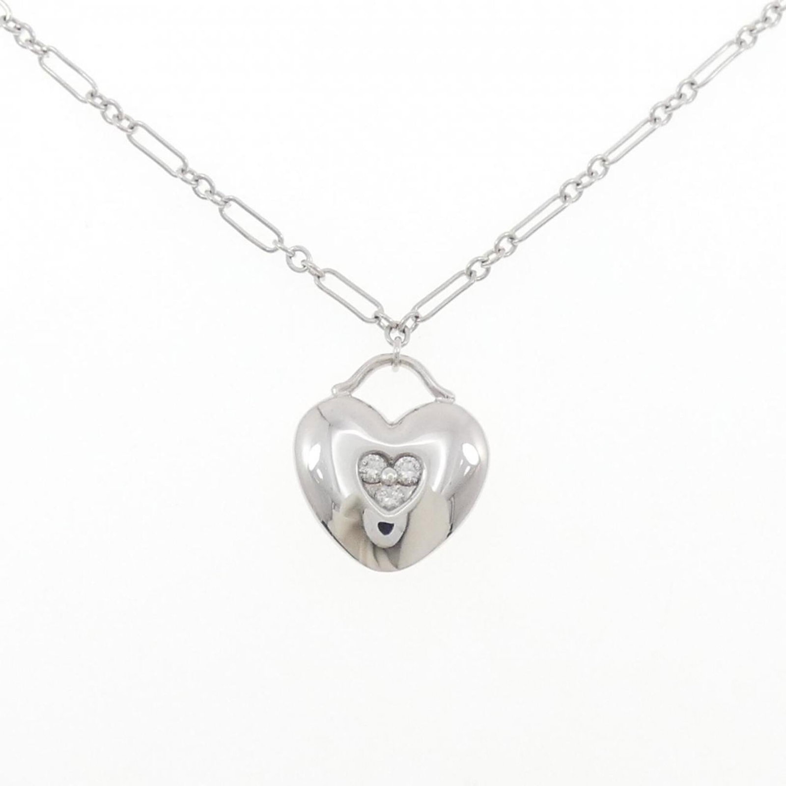 Diamond Necklace by Tiffany: Diamond Necklace by Tiffany White gold (18K) pendant, measuring 17.9mm x 15.6mm, suspended from a 41 cm / 16.14'' chain. This Tiffany necklace features a diamond pendant, adding elegance to any outfit