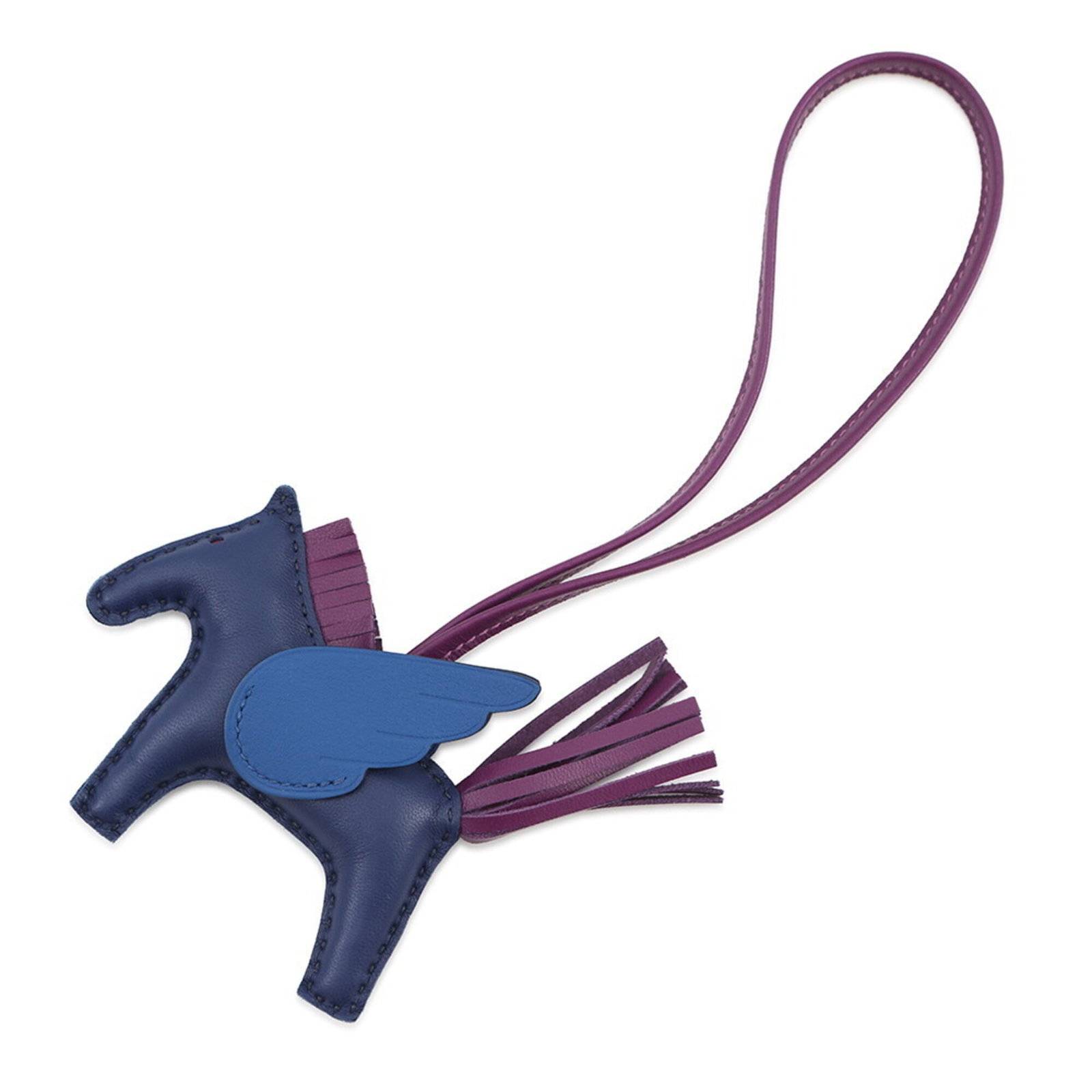 Handbag Charm by Hermes: Handbag Charm by Hermes Blue Hermes handbag charm from France, measuring 7.50mm x 13.00mm in size. This small, intricately designed charm bears a signature and showcases the brand's attention to detai