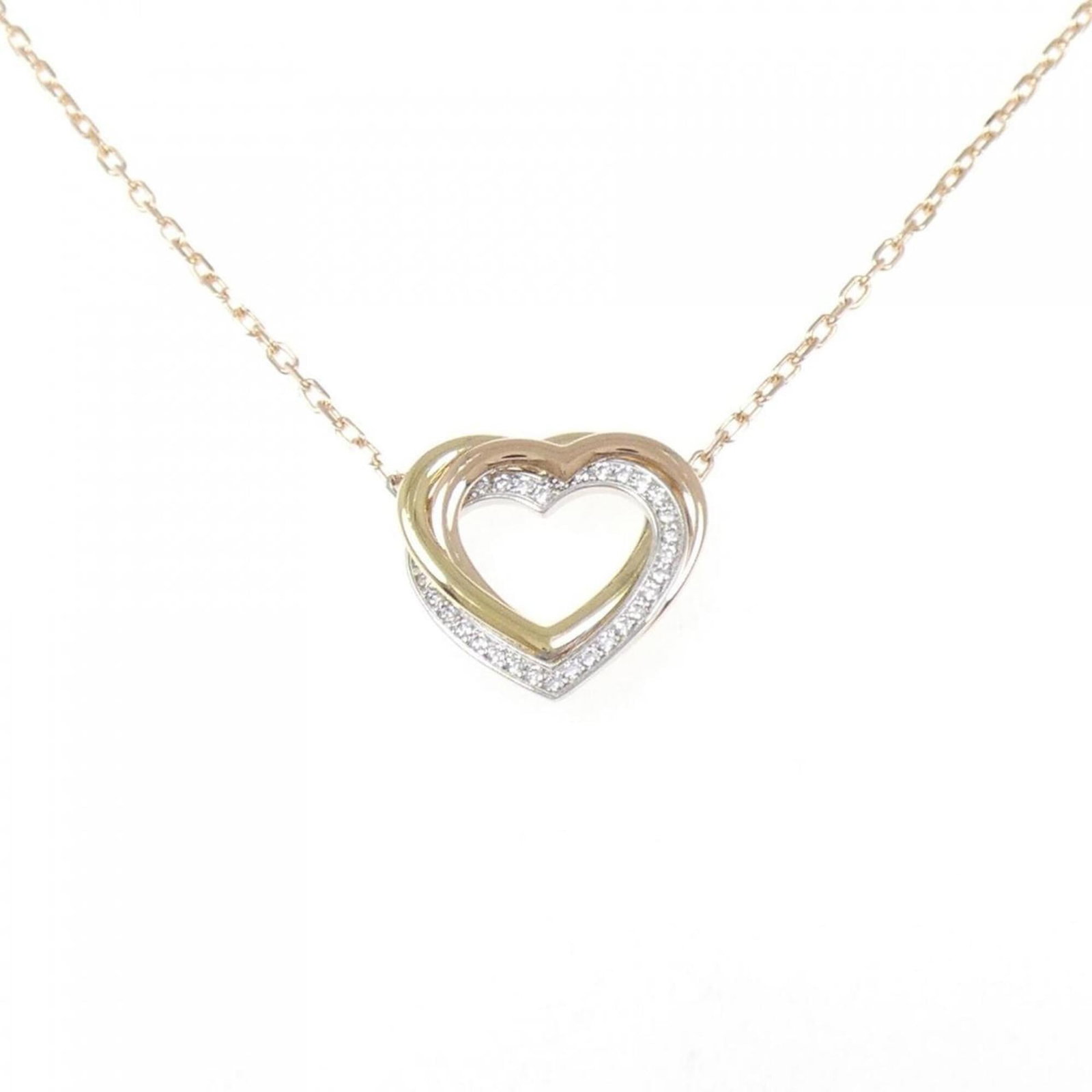 Trinity Heart Necklace by Cartier: Trinity Heart Necklace by Cartier Pink gold (18K), White gold (18K), and Yellow gold (18K) come together in the elegant Trinity Heart Necklace by Cartier, a masterpiece of fine jewelry design. The nec