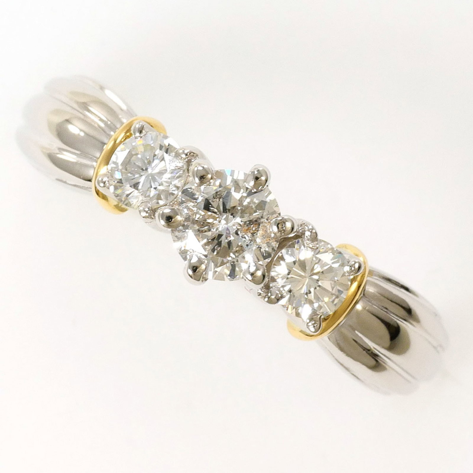Unbranded Platinum Gold 18K Yellow Ring Band: Unbranded Platinum Gold 18K Yellow Ring Band Platinum and yellow gold come together in this elegant 18K ring band, featuring a diamond weighing 0.584 carats with I1 clarity. The 5mm wide band is craft