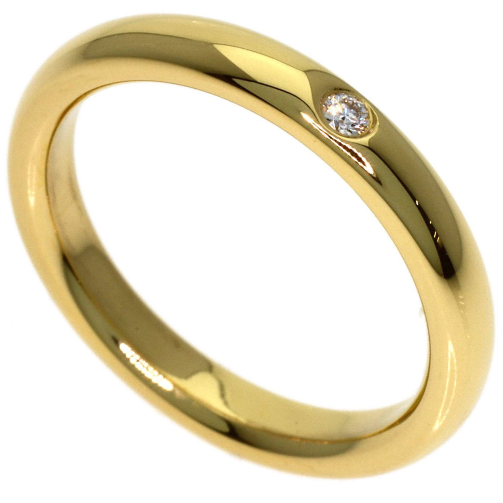 Ring Tiffany Band: Ring Tiffany Band 18K gold band ring with a yellow diamond, featuring a US size 5 fit and a sleek 2.8mm width. This classic Tiffany style ring boasts a sturdy weight of 3.9g and is crafted from