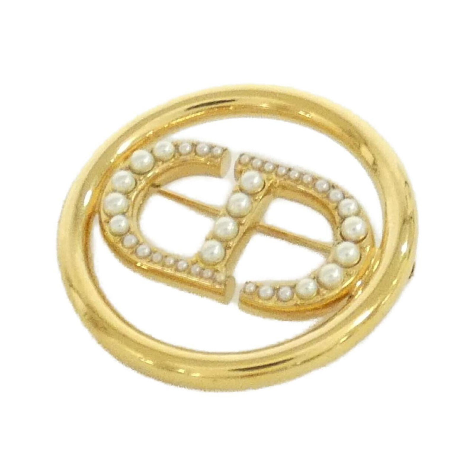 Christian Dior Brooch: Christian Dior Brooch Christian Dior's iconic brooch boasts elegant gold and white hues, measuring 3.5cm x 3.5cm in size. The piece comes with a luxurious box and dust bag for added protection and pre