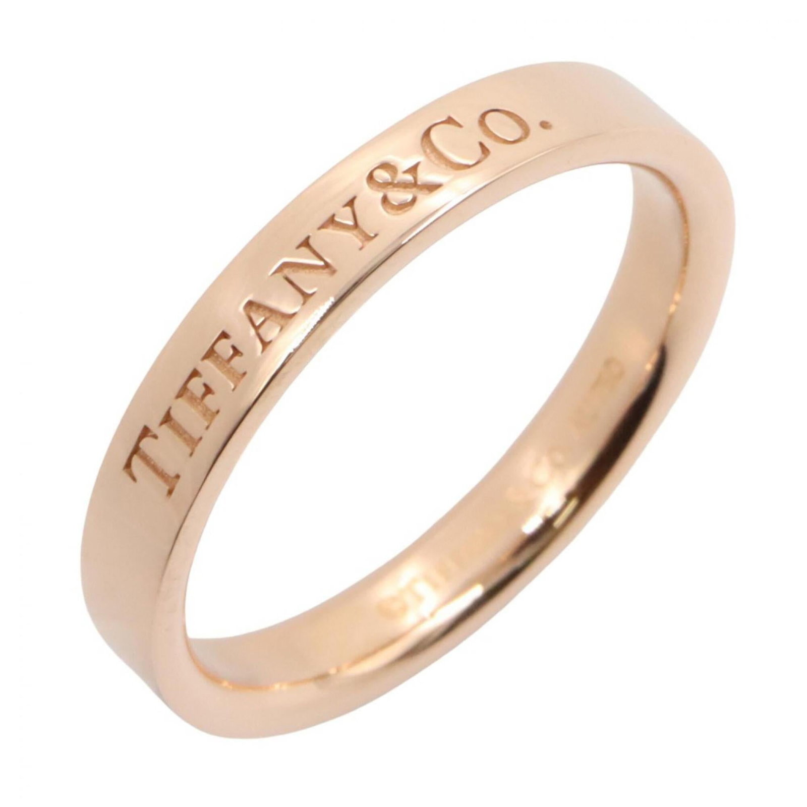 Pink Gold Tiffany Ring Band: Pink Gold Tiffany Ring Band Pink Gold Tiffany Ring Band. This 18K pink gold band features a classic design, showcasing the iconic Tiffany brand. Made to fit a US size 6, it's a beautiful accessory for