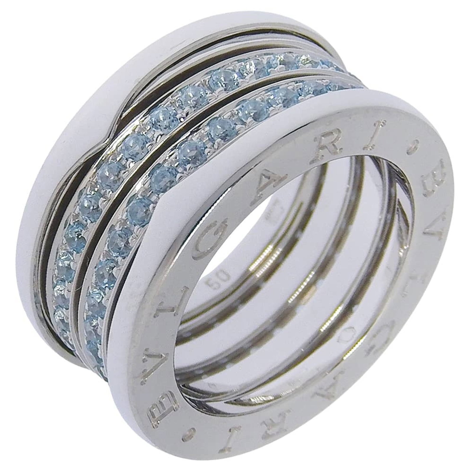 White Gold Bvlgari Ring Band: White Gold Bvlgari Ring Band Item Specifics: Brand: Bvlgari Line: B.zero1 Type: Band ring Gender: Women Material: White gold (18K) Stone: Topaz Stone Color: Blue US Size: 5 Width: 11mm / 0.43'' Inner