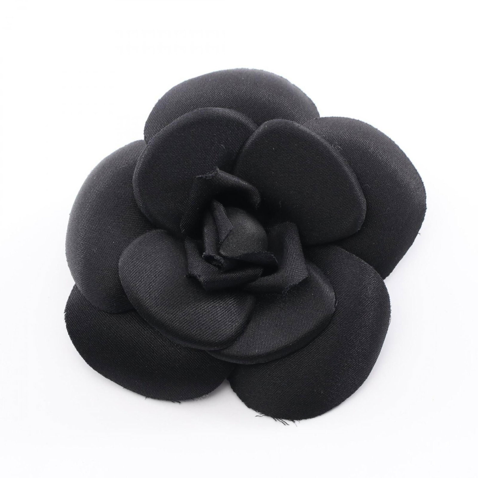 Chanel Brooch: Chanel Brooch Chanel's sleek black brooch boasts a compact size, measuring 10cm x 10cm. Its understated design makes it a versatile accessory that can add a touch of sophistication to any outfit. With