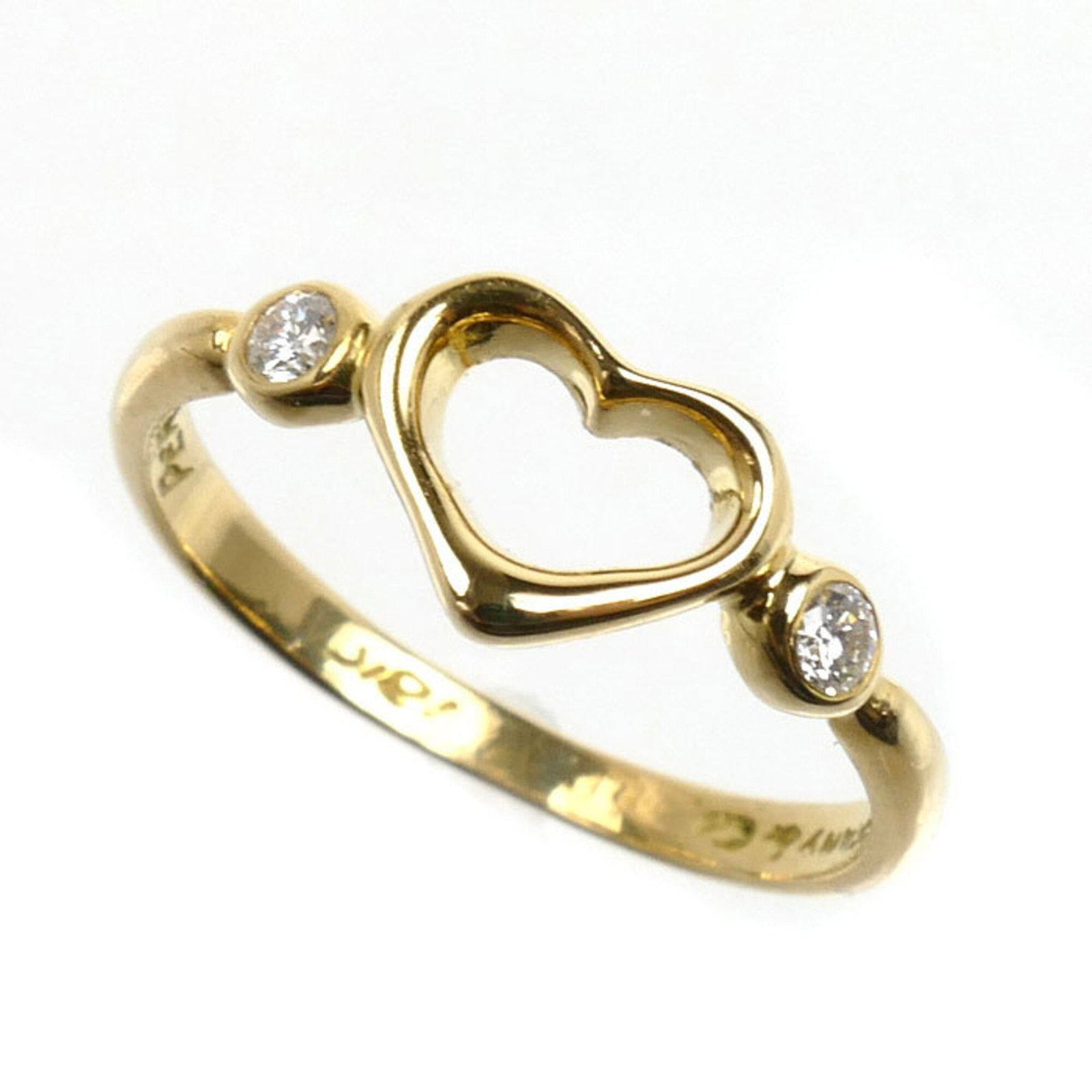 Yellow Gold 18K Tiffany Band Ring: Yellow Gold 18K Tiffany Band Ring Yellow gold (18K) band ring with a diamond stone, crafted by Tiffany in the USA. This elegant ring features 49 US size and a brand size of 5, suitable for women. The 