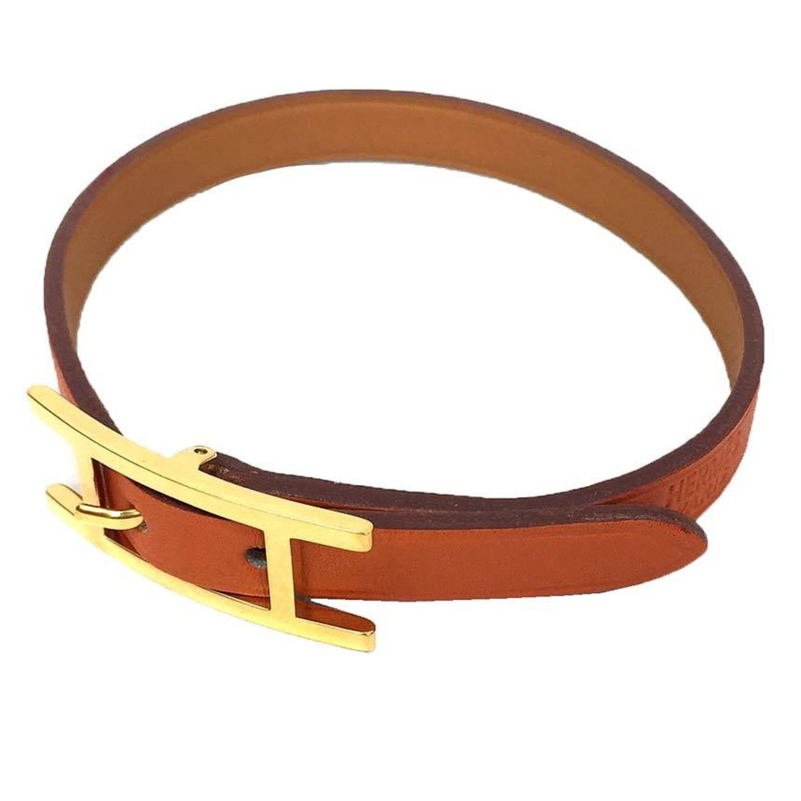 Hermes Charm Bracelet Leather: Hermes Charm Bracelet Leather Leather charm bracelet from Hermes, available in orange and measuring between 19.5cm to 21.5cm in length. This style features a simple design with no additional accessori