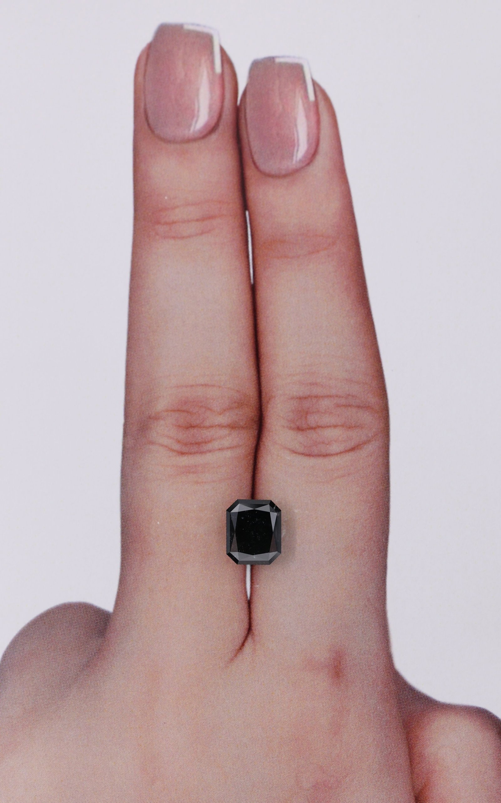 Radiant 1.76ct Fancy Black VVS2 - Loose Natural Diamond: Radiant 1.76ct Fancy Black VVS2 - Loose Natural Diamond 1.76ct Fancy Black VVS2 - Loose Natural Diamond with EX Polish and Symmetry, measuring 7.55L x 6.35W x 3.93H. This loose diamond boasts a high l
